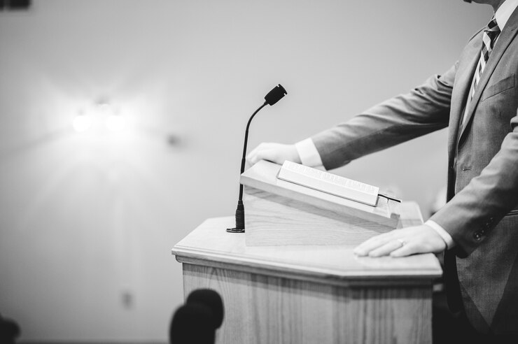 Man Speaking at the Podium